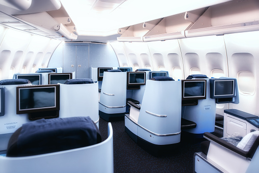 Airplane cabin business class interior view.