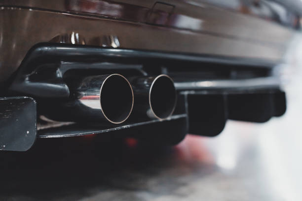 istock Close up of tuning white car exhaust pipe. 1166094734