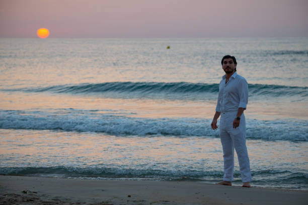 istock Man enjoying colorful sunset or sunrise 1166095485