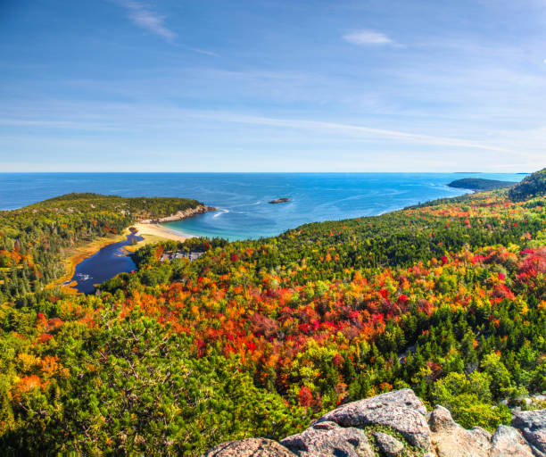 Panoramic view of the stunning fall colors and blue waters of the Bay in Acadia National Park stock photo