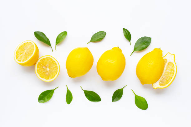 istock Fresh lemon with leaves isolated on white 1166105431