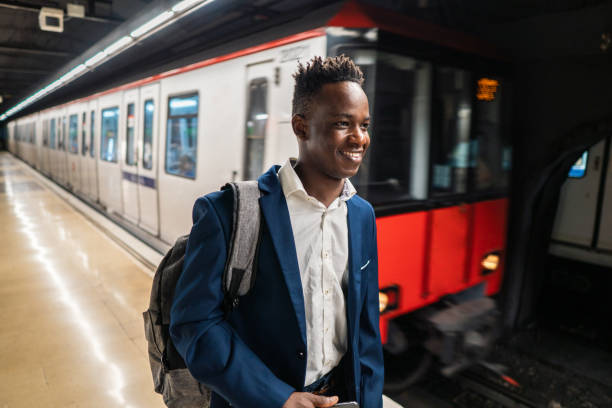 istock African American businessman wearing blue suit and backpack 1166105597