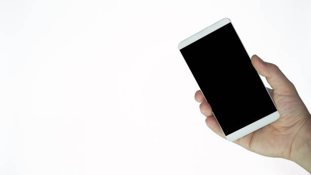 istock hand holding smart phone with black blank screen for concept visual 1166105828