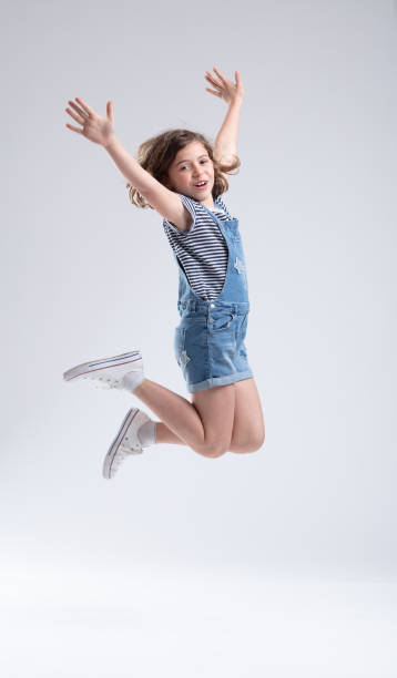 istock Agile energetic young girl leaping high 1166108713