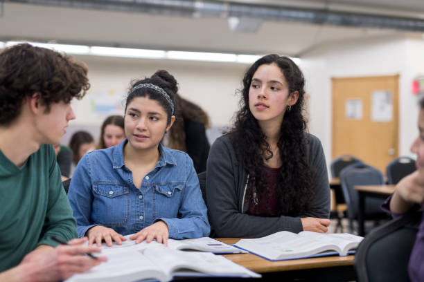 istock High school students work on an assignment together at their desks 1166110650