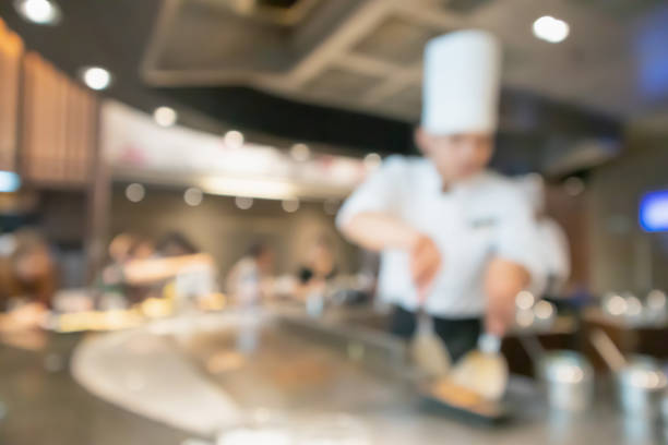 istock Chef cooking in restaurant kitchen abstract blurred defocused background 1166110701