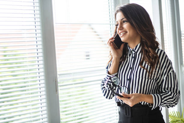 istock Smiling young entrepreneur on a conference call 1166110740
