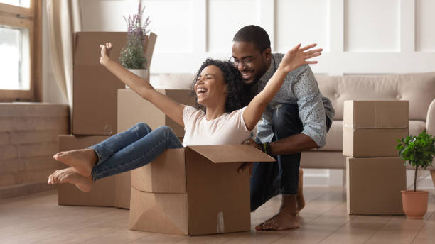 istock Happy black young couple have fun on moving day 1166111239