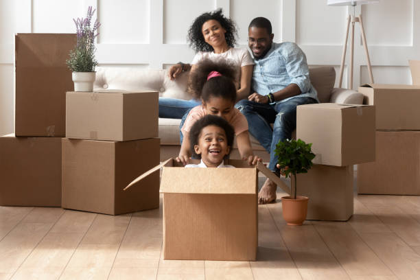 istock Excited little kids have fun playing on moving day 1166111247