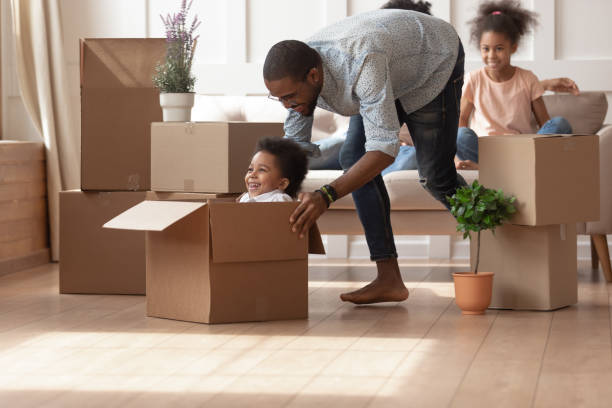 istock Happy black dad playing with small son on moving day 1166111297