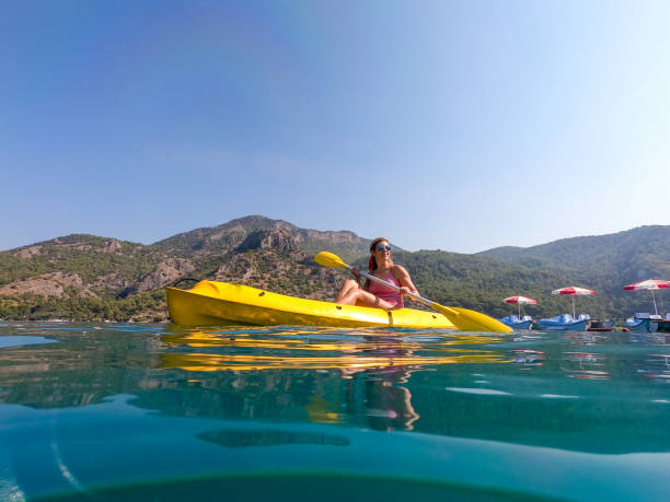 istock Woman on canoe. 1166112319