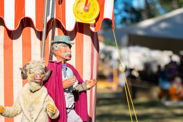Abbey Medieval Festival 2019 : Medieval puppets hung outside a tent waiting for the show. stock photo