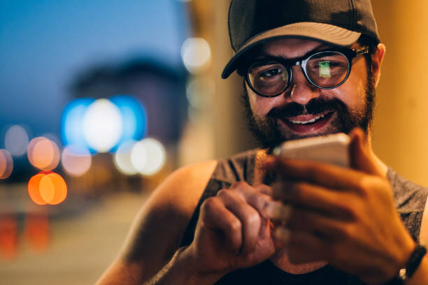 istock Millennial man eating outside 1166119393