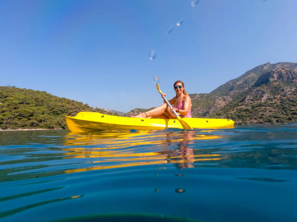 istock Woman on canoe. 1166120820