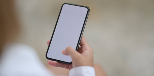 istock Woman's hands holding blank screen smartphone 1166127407