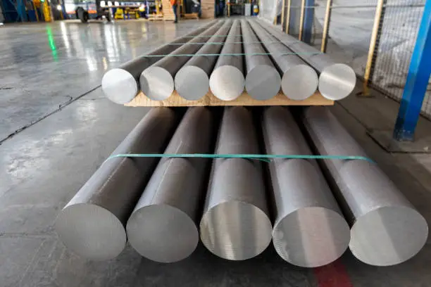 Photo of Aluminium (aluminum) production process and extrusion billets of aluminium in the factory. The conversion of alumina to aluminium metal is achieved by the Hall–Heroult process.