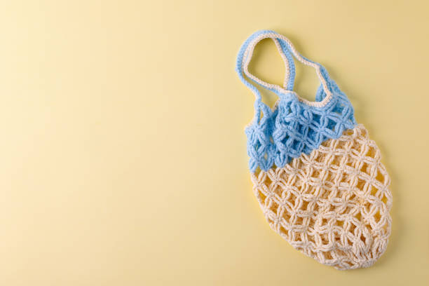 istock top view of empty yellow blue string bag on yellow background, zero waste eco-friendly trendy shopping minimal concept 1166130172