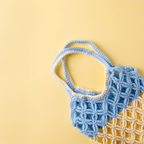 istock top view of empty yellow blue string bag on yellow background, zero waste eco-friendly trendy shopping minimal concept 1166130179