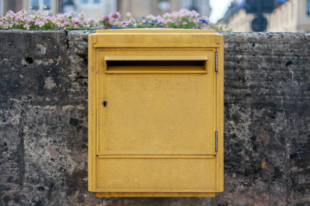 Bayeux, France. August 1st, 2019: Yellow La Poste Mailbox in France