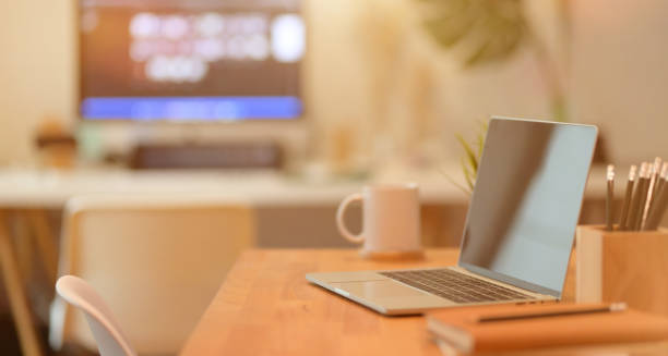 istock Minimal workplace with laptop computer and office supplies 1166131920