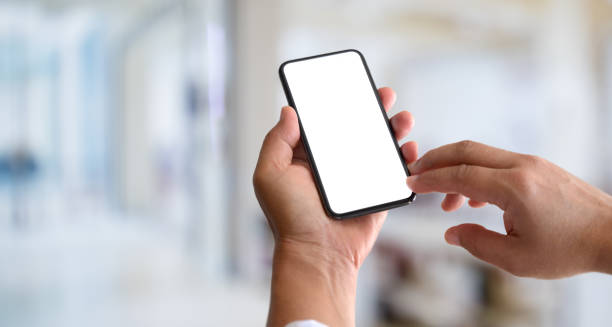 istock Cropped view of man's hands holding blank screen smartphone 1166132965