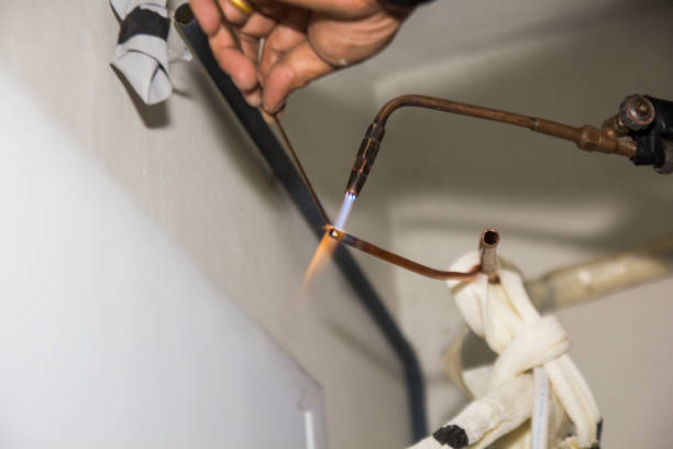 istock air conditioner mechanic Copper pipe welding 1166133682