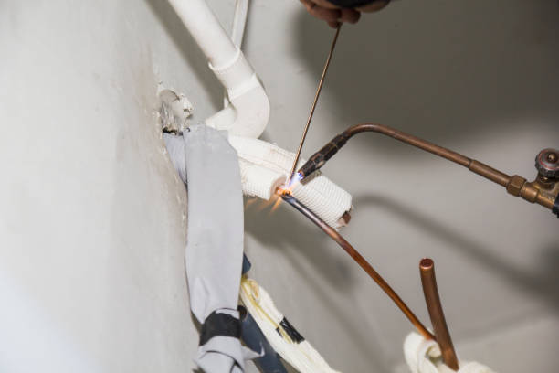 istock air conditioner mechanic Copper pipe welding 1166134621