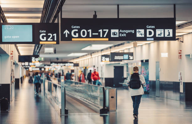 istock Peoples walking in Vienna airport terminal 1166137875