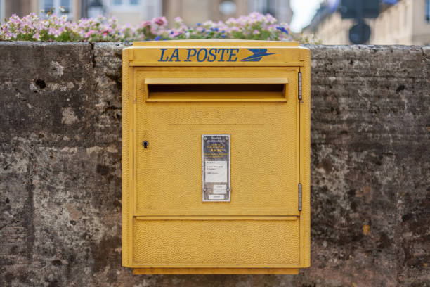 Bayeux, France. August 1st, 2019: Yellow La Poste Mailbox in France