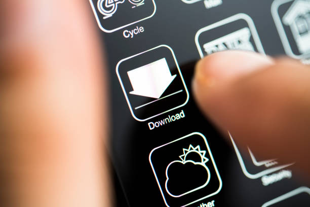 White app logo on black screen. Hand touching download app on dark mode phone screen.