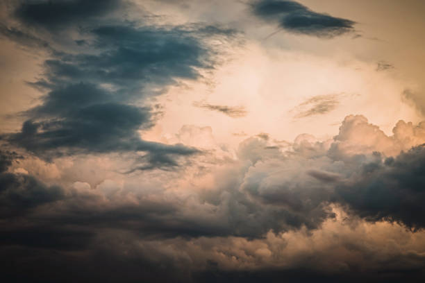 istock Stunning sky and sun behind dark grey clouds background. 1166145794