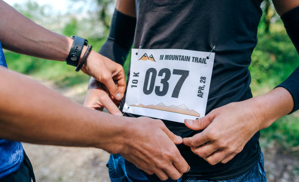 Girl placing the race number stock photo