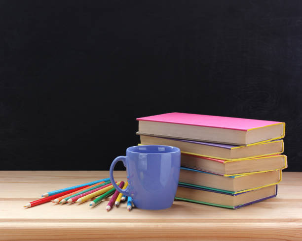 istock Textbooks in color covers and colored pencils. Back to school. 1166147177