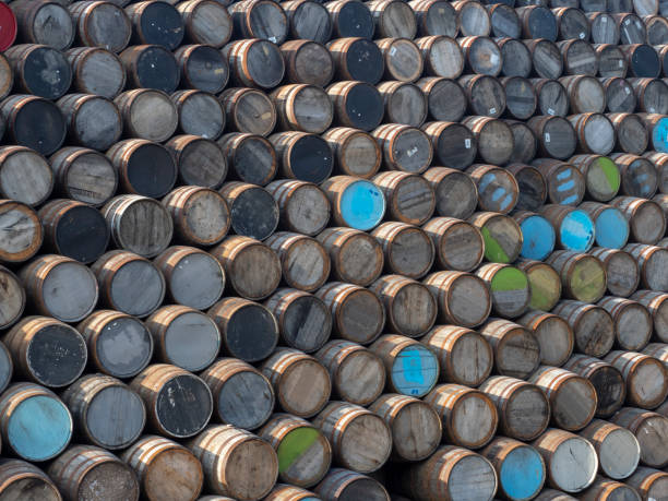 istock Whiskey Barrels stacked outside a Cooperage 1166150245
