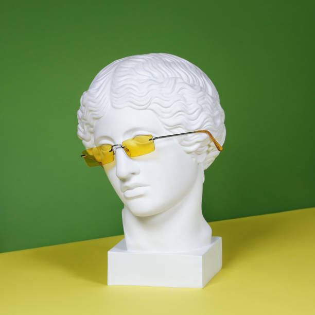 Plaster head with yellow sunglasses Plaster head model (mass produced replica of Head of an Amazon) wearing yellow eyeglasses bust sculpture photos stock pictures, royalty-free photos & images