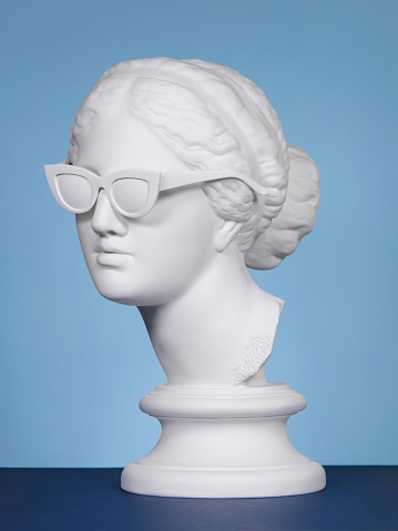 Plaster head model (mass produced replica of Head of Aphrodite of Knidos) wearing white sunglasses