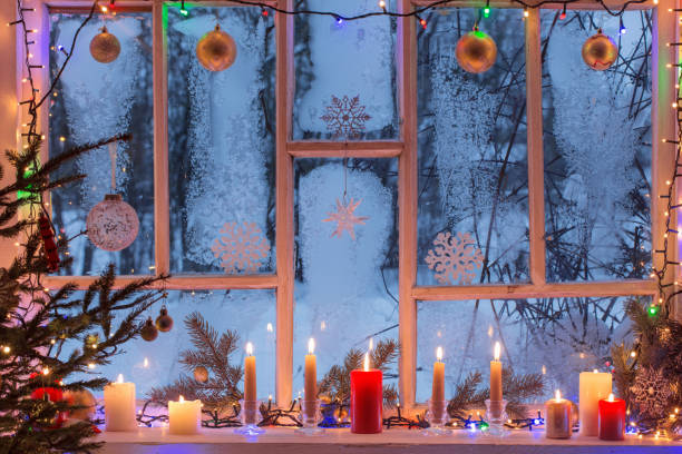 istock Christmas decorations on old wooden window 1166152131