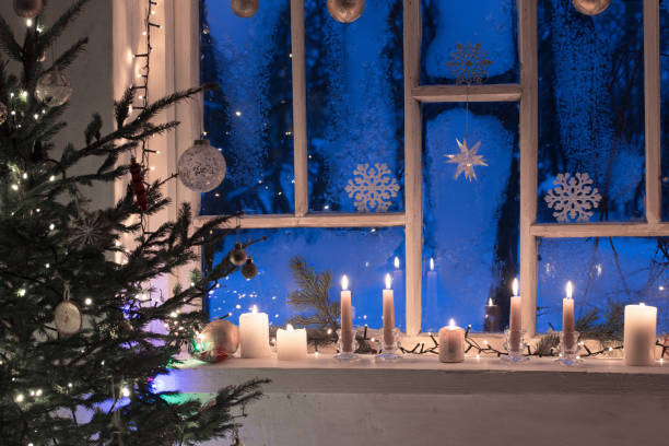 istock Christmas decorations on old wooden window 1166152143