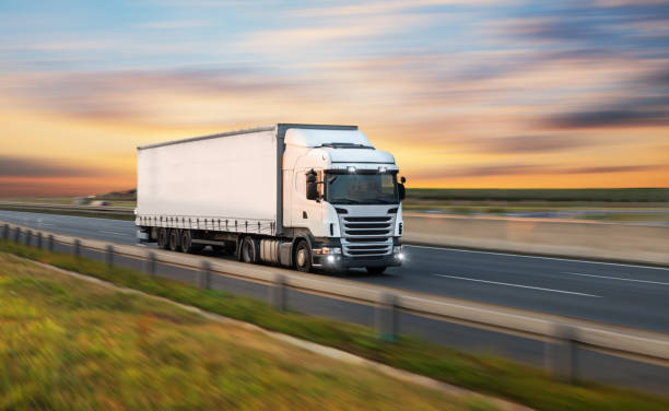 truck with container on road, cargo transportation concept. - semi truck fotos imagens e fotografias de stock