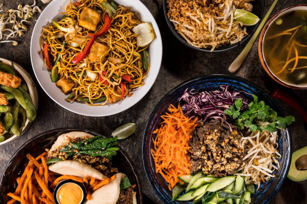 istock Asian food background with various ingredients on rustic wooden table. 1166153013