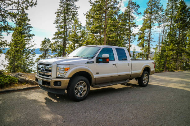 Yellowstone National Park, WY, USA - August 27, 2018: The F350 Ford parked along the preserve park stock photo