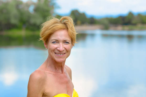 Smiling friendly woman in a swimsuit
