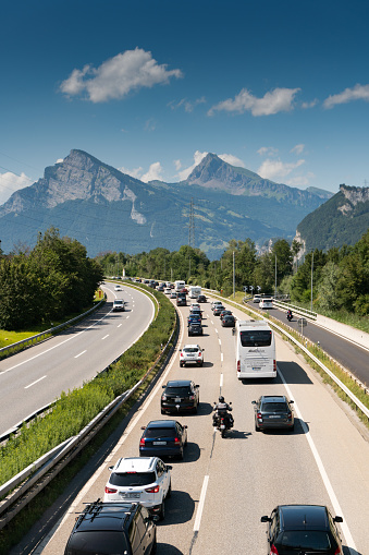 Maienfeld, GR / Switzerland - 4. August 2019: traffic jam on a highway in the mountains with many cars and people returning home from summer holidays