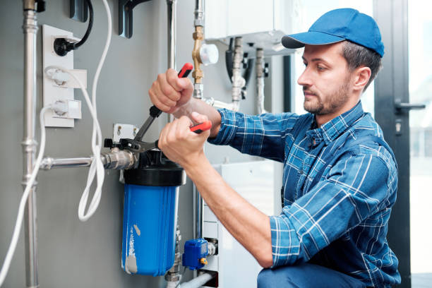 istock Young plumber or technician installing or repairing system of water filtration 1166155356