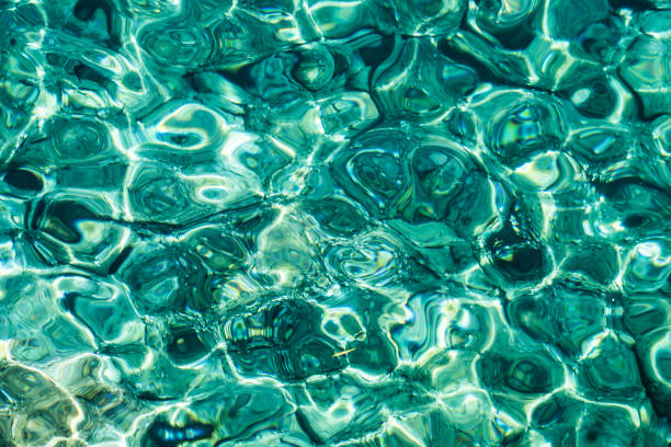 istock Turquoise sea surface with transparent shallow water 1166155931