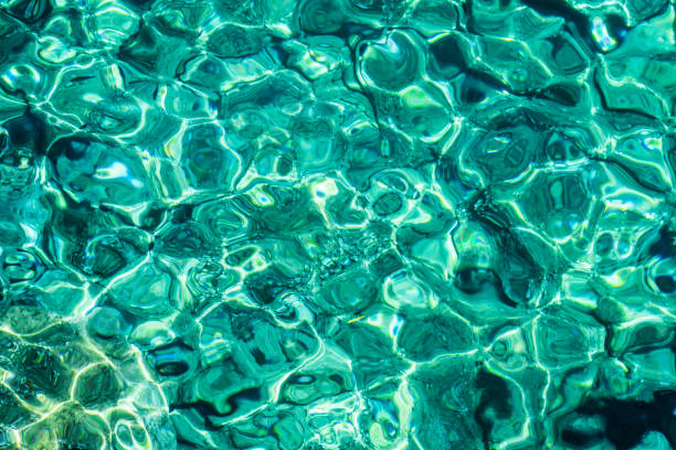 istock Turquoise sea surface with transparent shallow water 1166156646