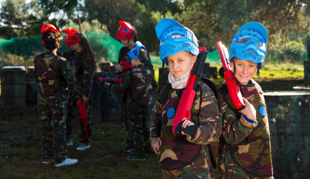 istock Two kids paintball players 1166158004