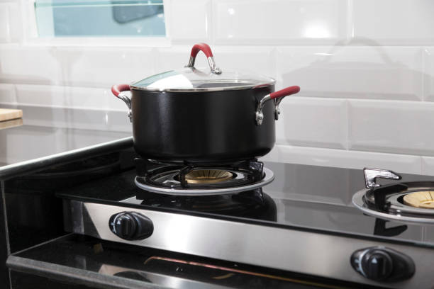 istock Metal Pot on induction hob in modern kitchen. 1166159871