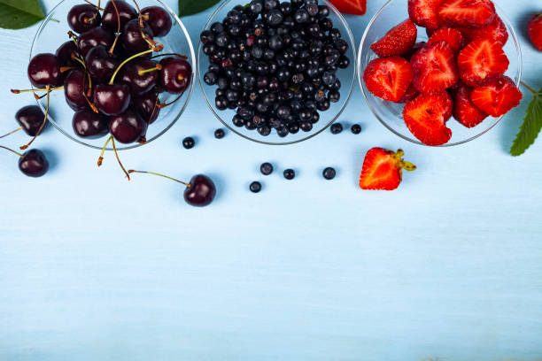 istock Ripe berries in transparent bowls 1166161056