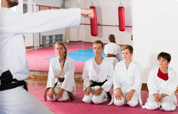 istock Kids taekwondo group ready to practice 1166161147